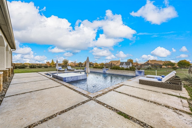 view of pool featuring a patio area