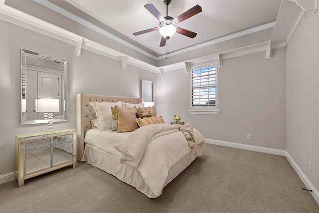 carpeted bedroom with ceiling fan and crown molding