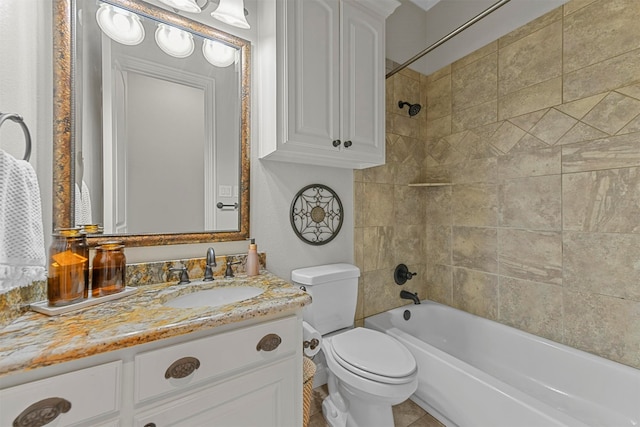 full bathroom featuring tile patterned floors, vanity, toilet, and tiled shower / bath