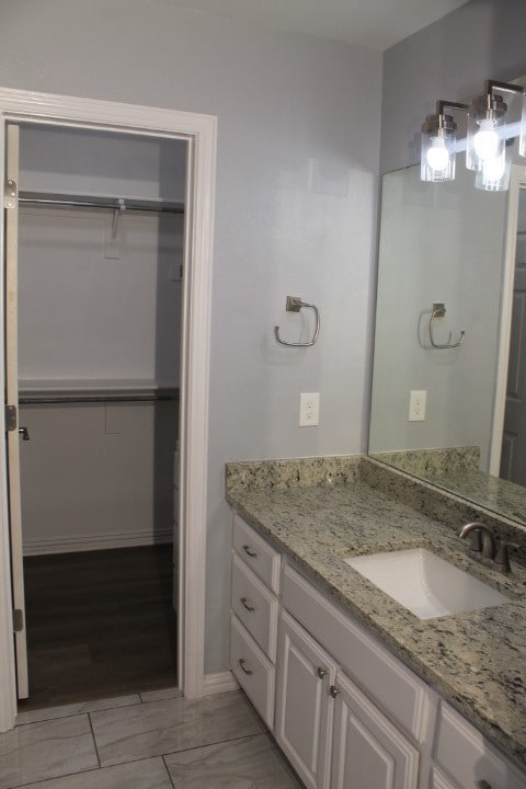 bathroom featuring vanity and hardwood / wood-style flooring