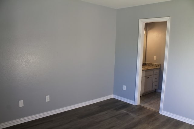 spare room with dark hardwood / wood-style flooring