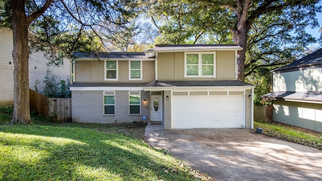 view of front of home featuring a front lawn and a garage