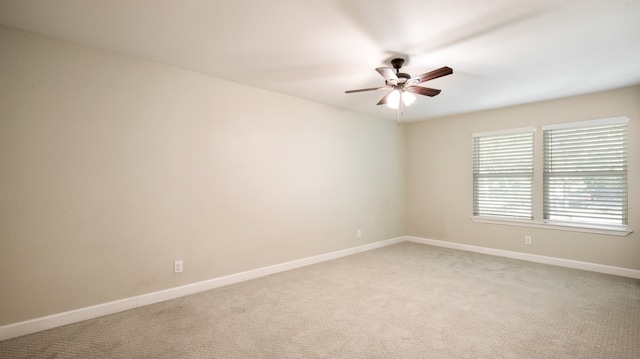 empty room featuring carpet flooring and ceiling fan