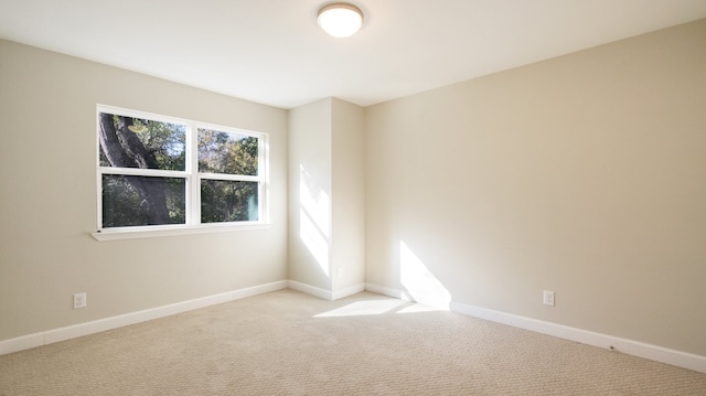 empty room featuring light colored carpet