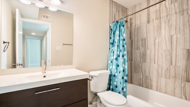 full bathroom featuring vanity, shower / bath combination with curtain, and toilet