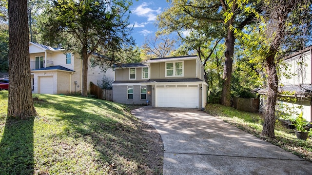 front of property featuring a garage and a front lawn