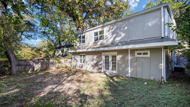 rear view of house featuring french doors