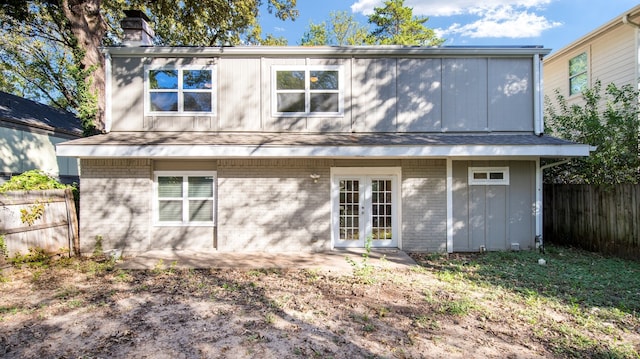 rear view of property featuring a patio and french doors