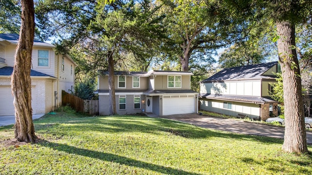 view of front of house featuring a garage and a front lawn