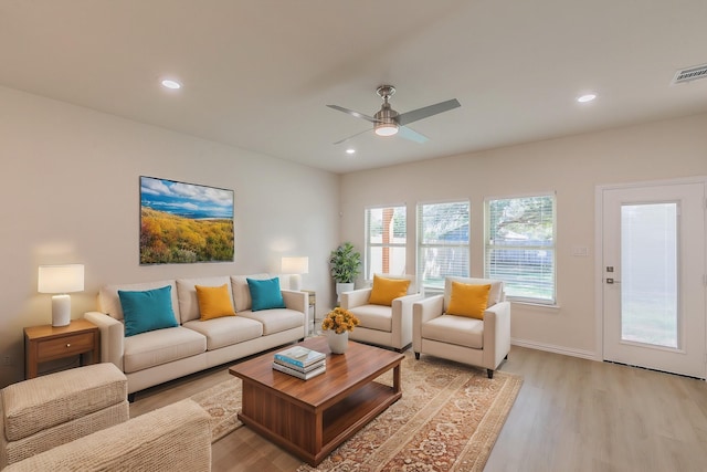 living area with ceiling fan, light wood-style flooring, visible vents, and recessed lighting