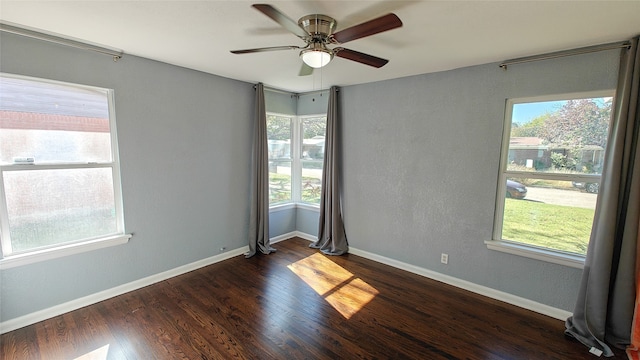 unfurnished room featuring ceiling fan and dark wood-type flooring