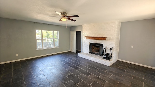 unfurnished living room with ceiling fan, dark hardwood / wood-style floors, and a brick fireplace