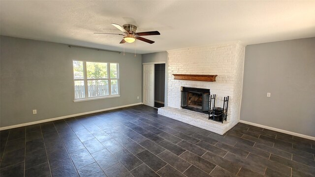 unfurnished living room with ceiling fan, dark hardwood / wood-style floors, and a brick fireplace