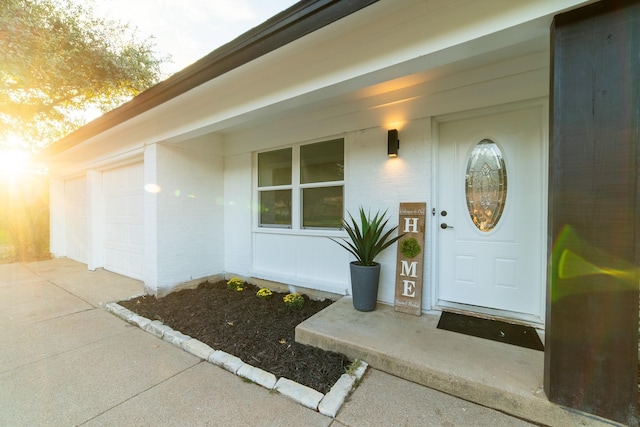 doorway to property featuring a garage