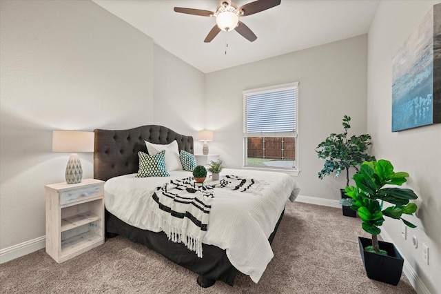 bedroom with ceiling fan, baseboards, and carpet floors