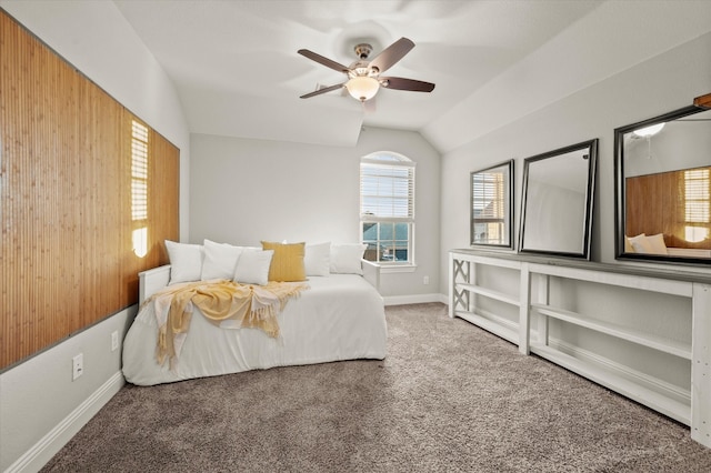 bedroom with ceiling fan, carpet floors, and lofted ceiling