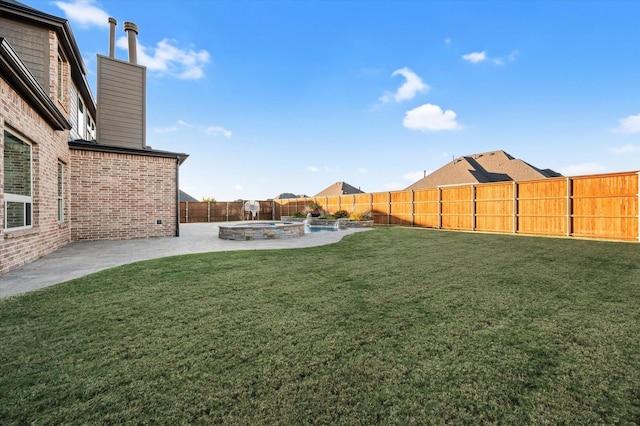 view of yard featuring a fenced backyard, a pool with connected hot tub, and a patio area