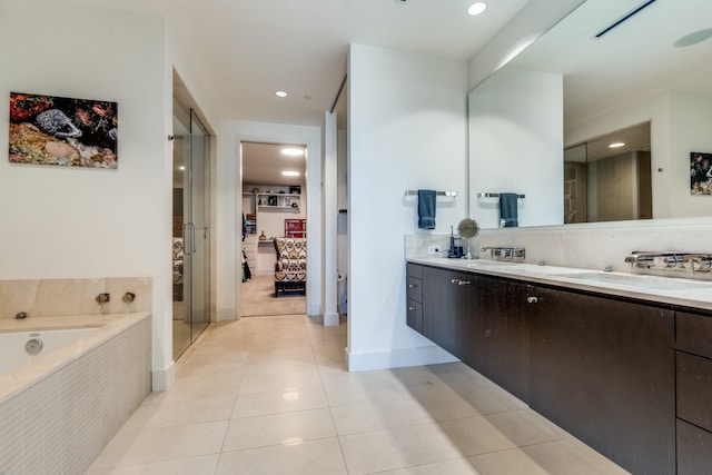 bathroom with tile patterned floors, vanity, and plus walk in shower