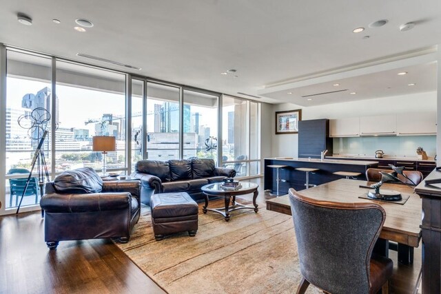 interior space with light wood-type flooring and floor to ceiling windows