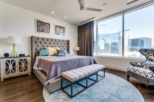 bedroom with ceiling fan and dark wood-type flooring