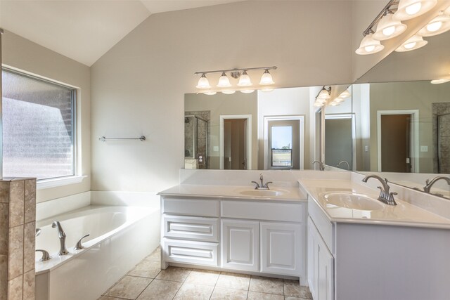 bathroom with shower with separate bathtub, vanity, tile patterned floors, and lofted ceiling