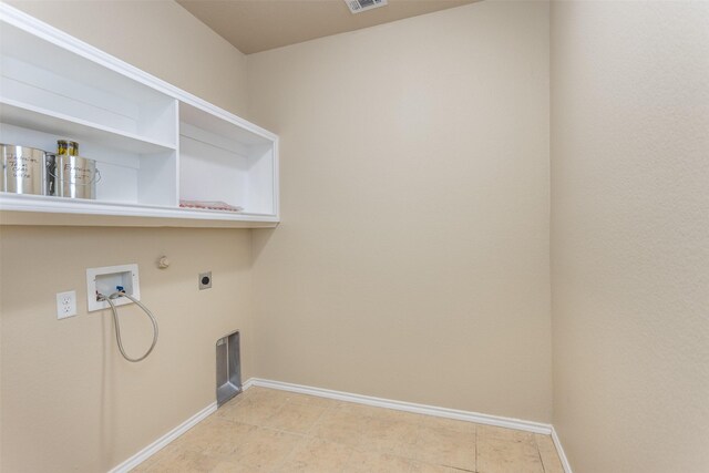 clothes washing area with electric dryer hookup, gas dryer hookup, light tile patterned floors, and hookup for a washing machine