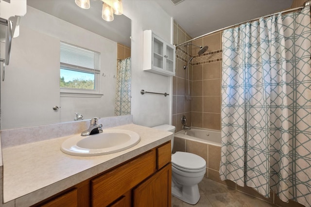 full bathroom with toilet, vanity, tile patterned flooring, and shower / tub combo with curtain