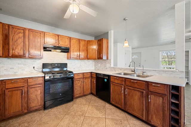 kitchen with decorative light fixtures, light tile patterned floors, black appliances, ceiling fan, and sink