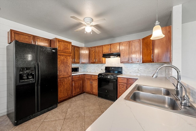 kitchen featuring black appliances, ceiling fan, sink, decorative light fixtures, and backsplash