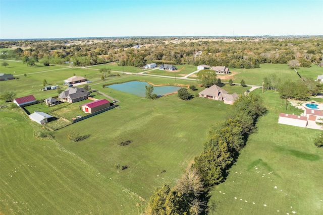 drone / aerial view with a rural view and a water view