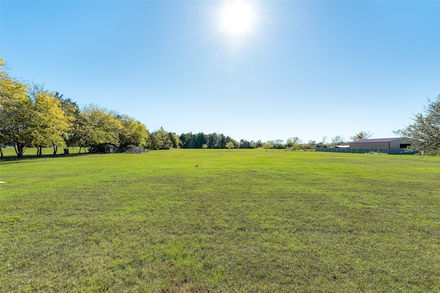 view of yard with a rural view