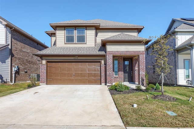 view of front facade featuring a front yard and a garage