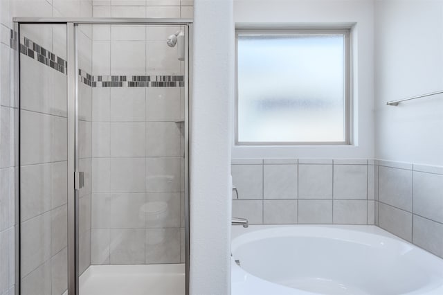 bathroom with separate shower and tub