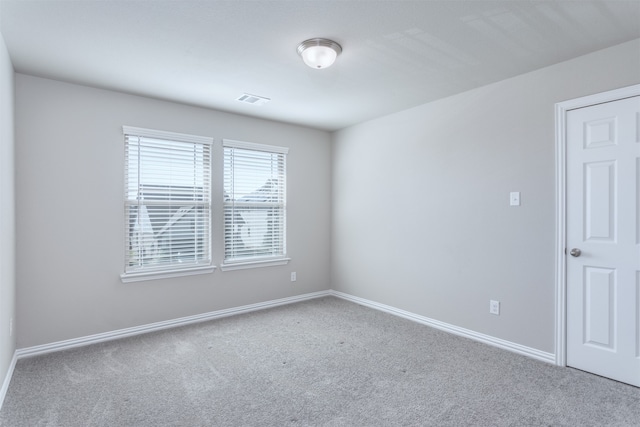 spare room featuring carpet floors