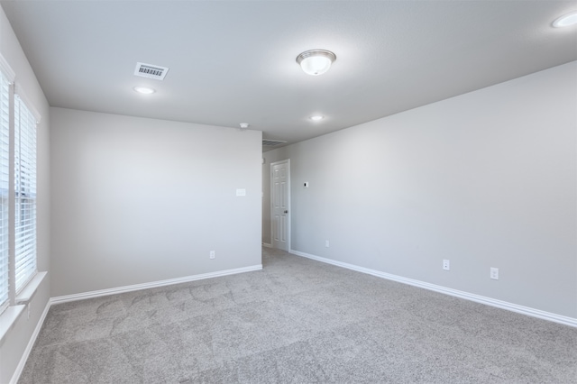 carpeted empty room with plenty of natural light