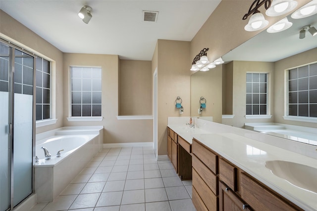 bathroom featuring vanity, tile patterned floors, and separate shower and tub