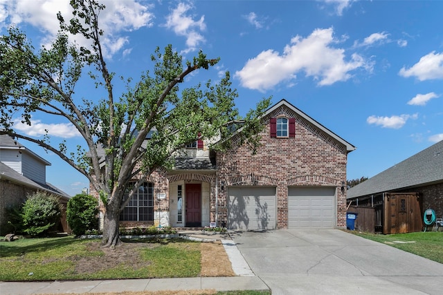 view of front property featuring a garage and a front lawn