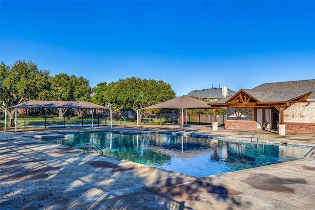 view of swimming pool featuring a patio area