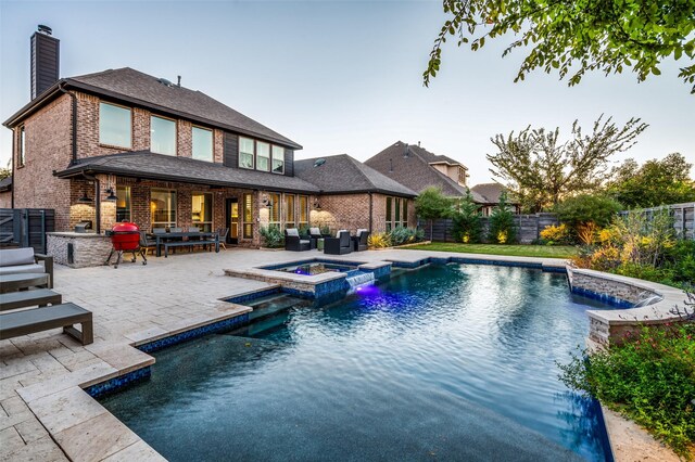 view of front of house with a garage and a front yard