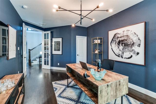 office space with a notable chandelier, visible vents, baseboards, and dark wood-style flooring