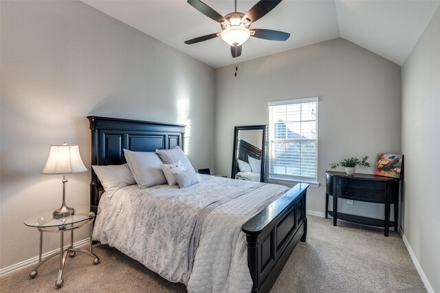 bedroom featuring ceiling fan, light carpet, and vaulted ceiling