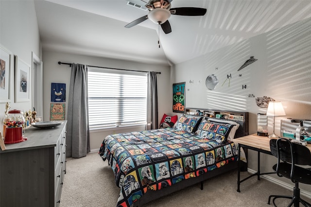 bedroom featuring a ceiling fan, light colored carpet, vaulted ceiling, and visible vents