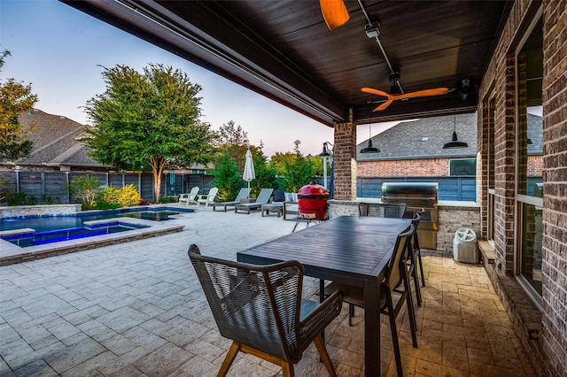 view of patio with a fenced backyard, a ceiling fan, exterior kitchen, a fenced in pool, and a hot tub