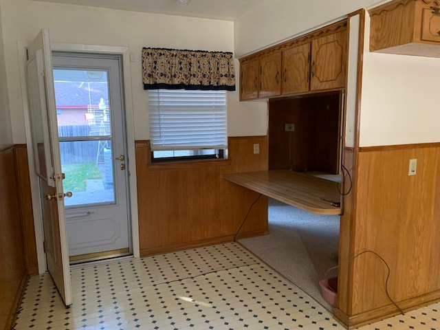 kitchen featuring wood walls