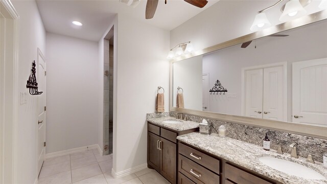 bathroom featuring tile patterned floors, ceiling fan, and vanity