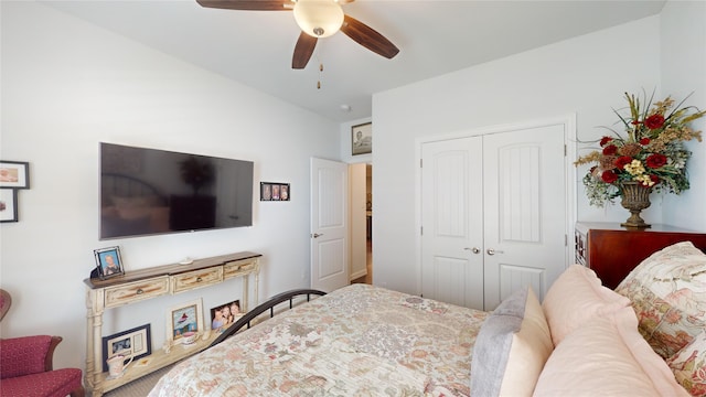 bedroom with ceiling fan and a closet