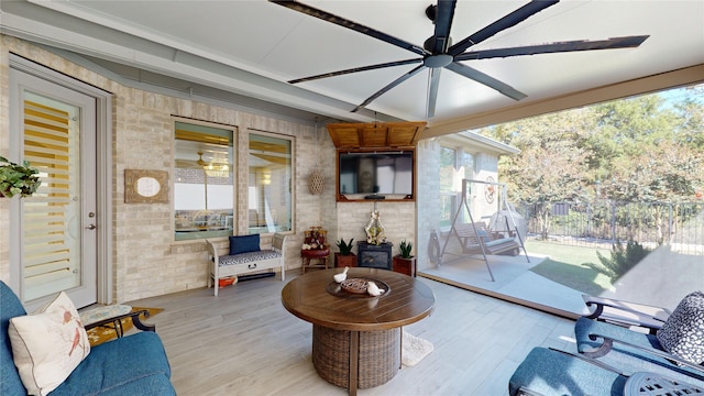 interior space featuring ceiling fan and a healthy amount of sunlight