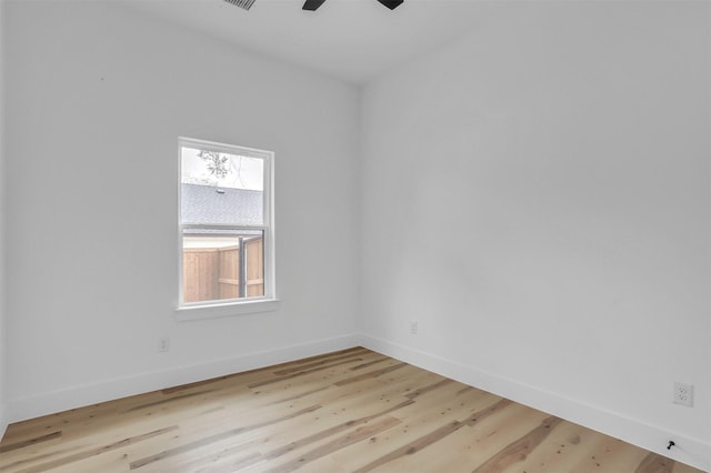 unfurnished room with light wood-type flooring and ceiling fan