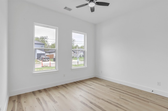 spare room featuring ceiling fan and light hardwood / wood-style flooring