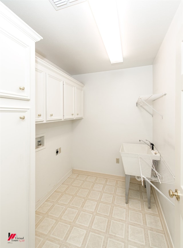 laundry room with hookup for an electric dryer, cabinets, and hookup for a washing machine